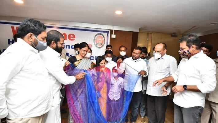 Telangana ministers congratulate Weaver for weaving a sari in a matchbox .. Telangana ministers congratulate Weaver for weaving a sari in a matchbox ..