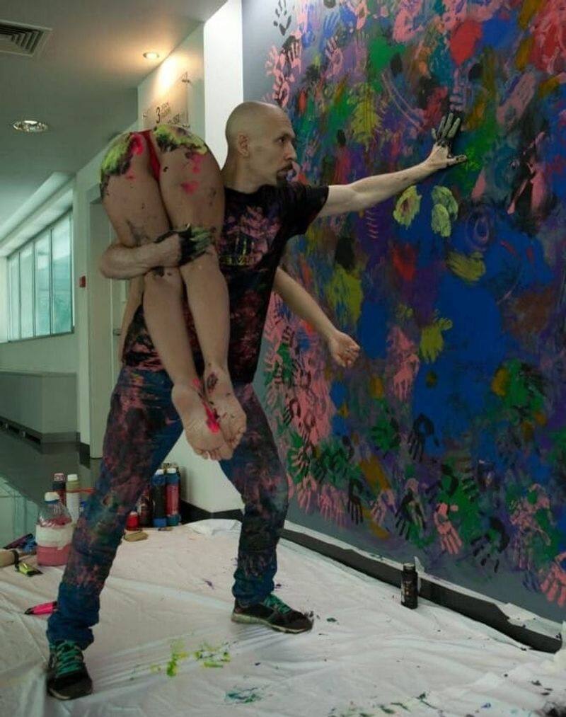 Albert Zakirov artist using naked women as paintbrush