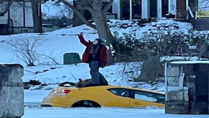 Canada woman takes selfie pose on the top of car which is sinking in river see in viral video Canada woman takes selfie pose on the top of car which is sinking in river see in viral video