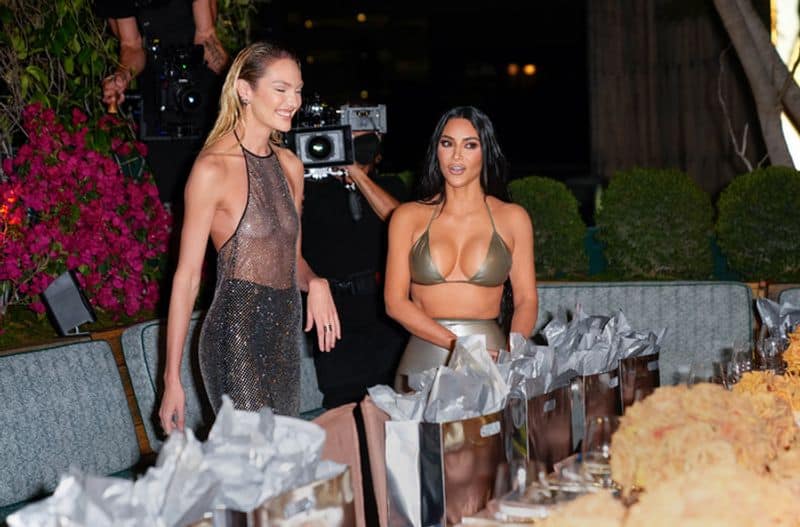 Kim Kardashian slays in silver bra as she hits Swim pop-up in