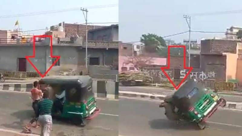 In Baghdad Uttar Pradesh two youths were injured when a speeding auto overturned as some youths threw water filled balloons viral video