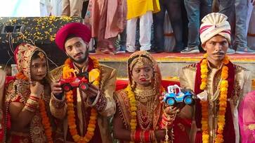 Newlywed couples receive bulldozers as gift in mass wedding in UP Prayagraj-dnm Newlywed couples receive bulldozers as gift in mass wedding in UP Prayagraj-dnm