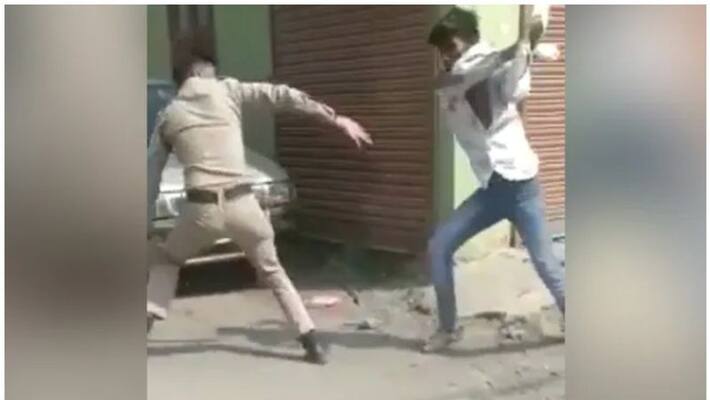 Man Snatches Cop's Baton And Thrashes Him Man Snatches Cop's Baton And Thrashes Him