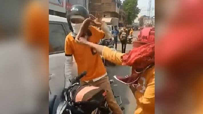 woman beats man with her shoe after bike accident woman beats man with her shoe after bike accident