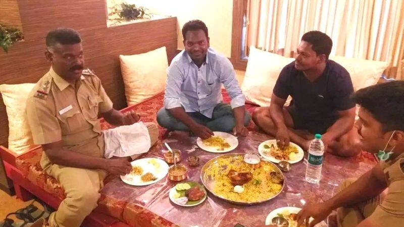 A police inspector who sat down with people arrested in a cannabis smuggling case and ate biryani has been transferred to the waiting list