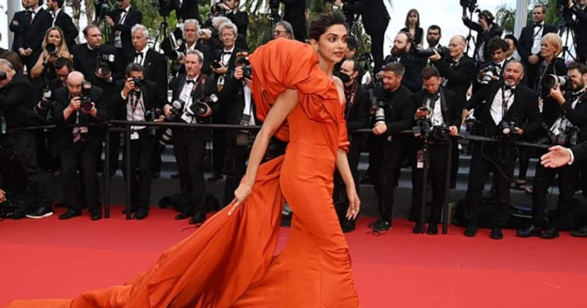 Deepika Padukone Photos In Orange Dress With Glass - Actress Album