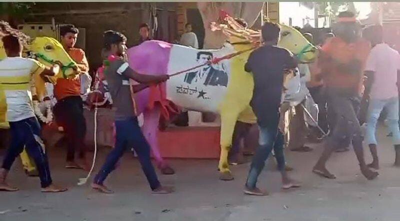 Full moon day Farmer paints Puneeth Rajkumar on his ox takes it to procession in Vijayapura vcs