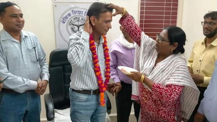 there was protest on social media because muslim teacher in aligarh applying tilak to new joined teacher there was protest on social media because muslim teacher in aligarh applying tilak to new joined teacher