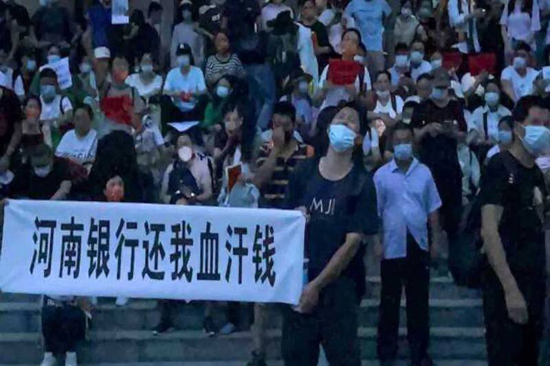 protest economic crisis and frozen millions of dollars worth of deposits in china