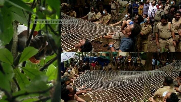 prisoner escaped from Poojappura Central Jail and climb up on tree and suicide threat prisoner escaped from Poojappura Central Jail and climb up on tree and suicide threat