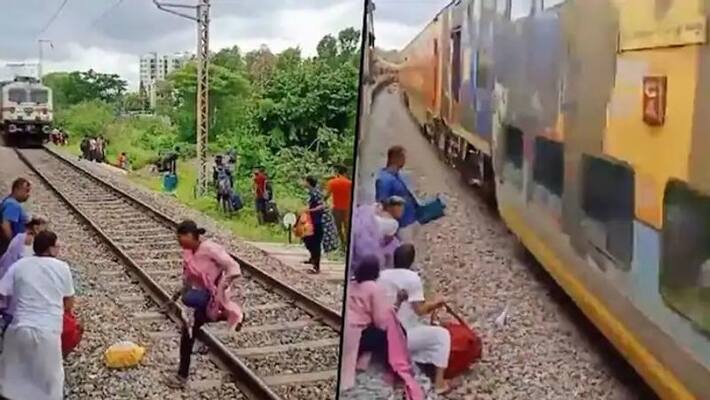 Woman escapes death while crossing railway track: hair-raising video enrages netizens ANBSS Woman escapes death while crossing railway track: hair-raising video enrages netizens ANBSS