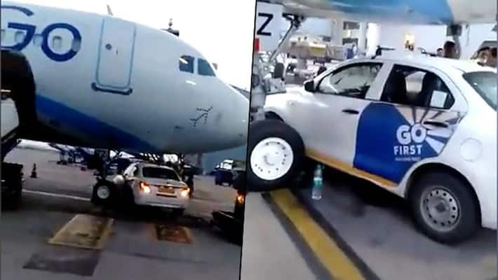 Go First car goes under IndiGo plane; narrowly escapes collision with nose wheel at Delhi airport - adt Go First car goes under IndiGo plane; narrowly escapes collision with nose wheel at Delhi airport - adt