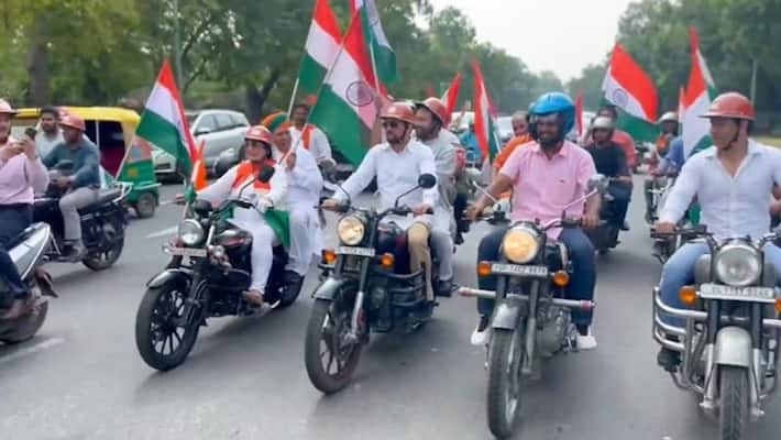 MPs take part in a Tiranga bike rally starting from Red Fort to Parliament - adt MPs take part in a Tiranga bike rally starting from Red Fort to Parliament - adt