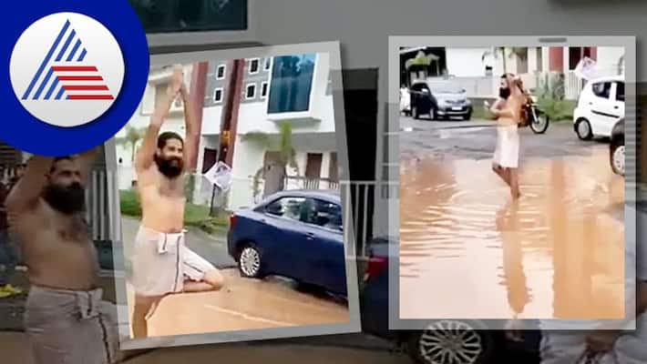 Kerala man takes bath in Pothole To Protest aganist damaged road akb Kerala man takes bath in Pothole To Protest aganist damaged road akb