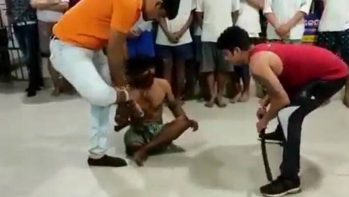 Atrocious in Odisha.. A person threatening a disabled person and forcefully pressed his feet.. Video viral Atrocious in Odisha.. A person threatening a disabled person and forcefully pressed his feet.. Video viral