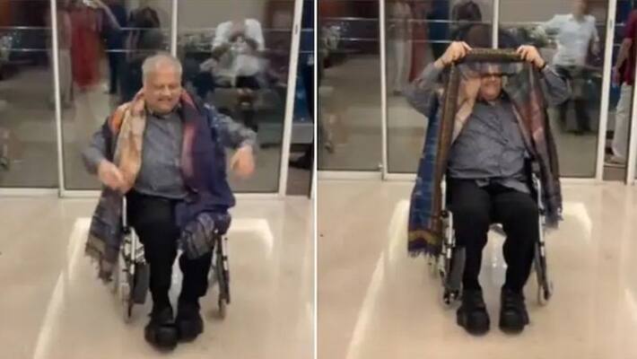 Rakesh Jhunjhunwala grooving to popular Aishwarya Rai song Kajra Re video while sitting on a wheelchair akb Rakesh Jhunjhunwala grooving to popular Aishwarya Rai song Kajra Re video while sitting on a wheelchair akb