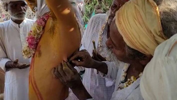 In Madhya Pradesh the body is pierced with an iron needle in the name of tradition dva In Madhya Pradesh the body is pierced with an iron needle in the name of tradition dva