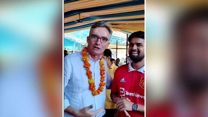 Seeking divine intervention... UK envoy roasts Manchester United supporter at temple in Delhi - adt Seeking divine intervention... UK envoy roasts Manchester United supporter at temple in Delhi - adt