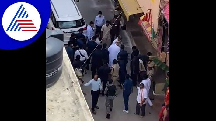 Telangana state Bjp president Bandi sanjaykumar fetching the sandals of Union Home Minister video viral, congress TRS slams akb Telangana state Bjp president Bandi sanjaykumar fetching the sandals of Union Home Minister video viral, congress TRS slams akb
