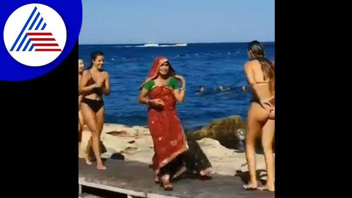 Indian woman shows uniqueness in foreign beach with her traditional wear saree akb Indian woman shows uniqueness in foreign beach with her traditional wear saree akb