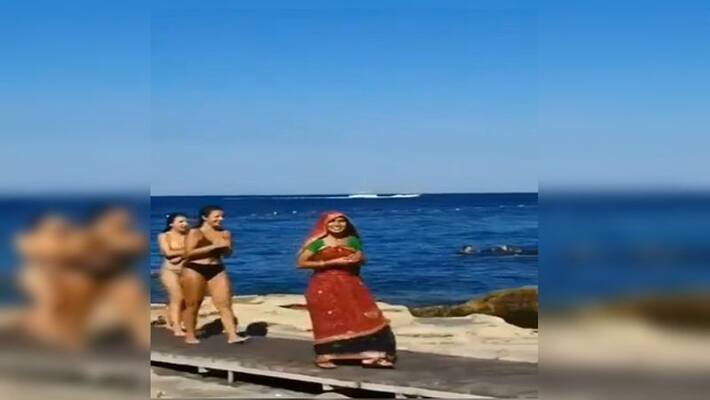 Sari claded woman in the crowd of bikini girls in a beach video goes viral ANBISD Sari claded woman in the crowd of bikini girls in a beach video goes viral ANBISD