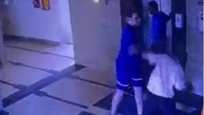 gurugram businessmen beats up security guard lift operator at posh society arrested video viral ash gurugram businessmen beats up security guard lift operator at posh society arrested video viral ash