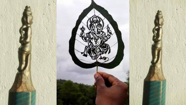 Artist's handiwork, Ganesha carved on Ashwattha leaf and pencil led akb Artist's handiwork, Ganesha carved on Ashwattha leaf and pencil led akb