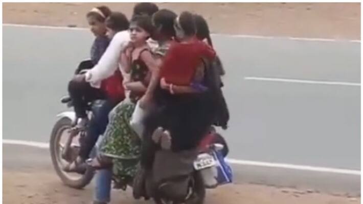 seven family members on single bike.. video going viral in social media seven family members on single bike.. video going viral in social media