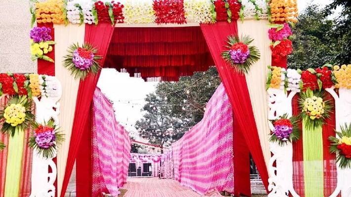 guests showing aadhaar card to brides relatives to enter wedding hall guests showing aadhaar card to brides relatives to enter wedding hall