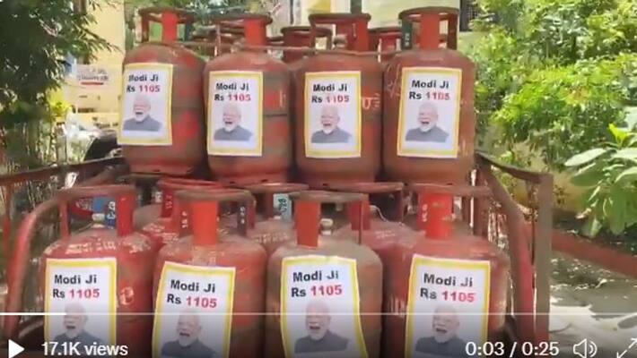 By pasting Modi's picture on the cylinder, the TRS party demonstrated its sarcasm. By pasting Modi's picture on the cylinder, the TRS party demonstrated its sarcasm.