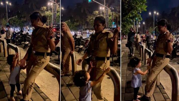 Child begging for police lathi to a woman cop a cute video Child begging for police lathi to a woman cop a cute video