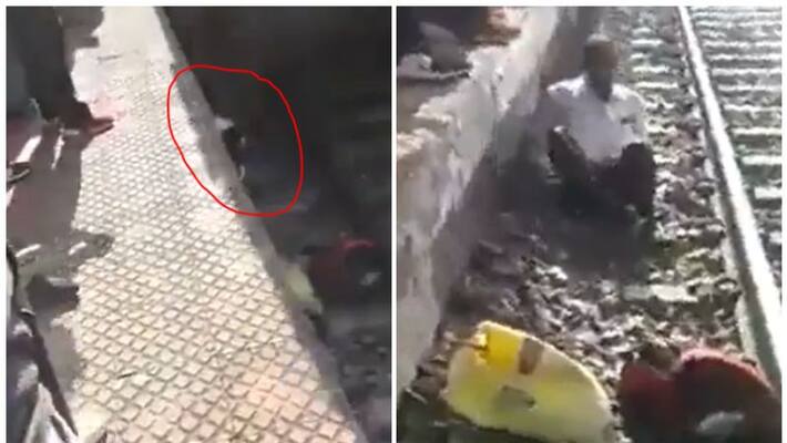 Man survives after train passes over him in shocking video Man survives after train passes over him in shocking video