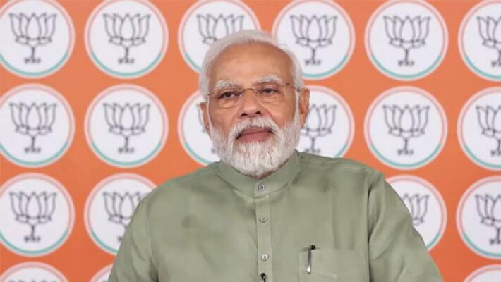 Prime Minister Narendra Modi interacts with beneficiaries of various schemes at Olpad in Surat, Gujarat kpa Prime Minister Narendra Modi interacts with beneficiaries of various schemes at Olpad in Surat, Gujarat kpa