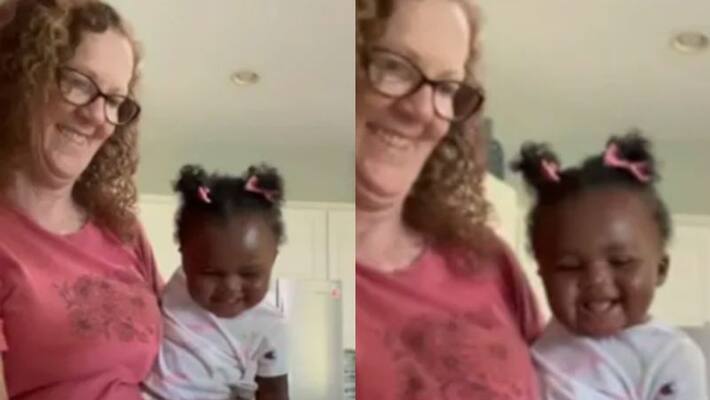 Baby Bursts Out Laughing As Grandma Cuts Vegetables Baby Bursts Out Laughing As Grandma Cuts Vegetables
