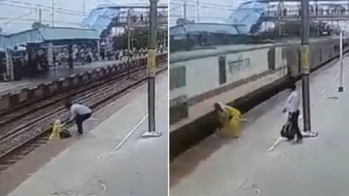 Woman crossing railway track when train enter to the station Woman crossing railway track when train enter to the station