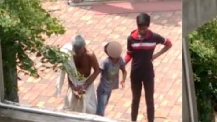 In a viral video, two men used ropes and tied a boy to a tree in Madhya Pradesh Siddhayatan Jain temple. In a viral video, two men used ropes and tied a boy to a tree in Madhya Pradesh Siddhayatan Jain temple.
