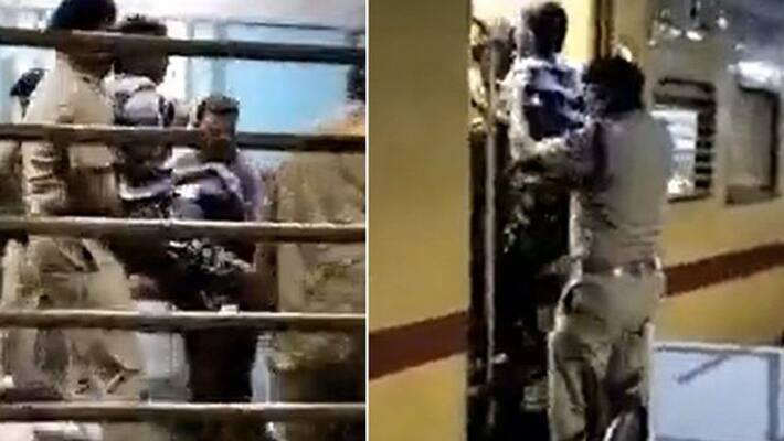 police officer helps disabled man board train police officer helps disabled man board train