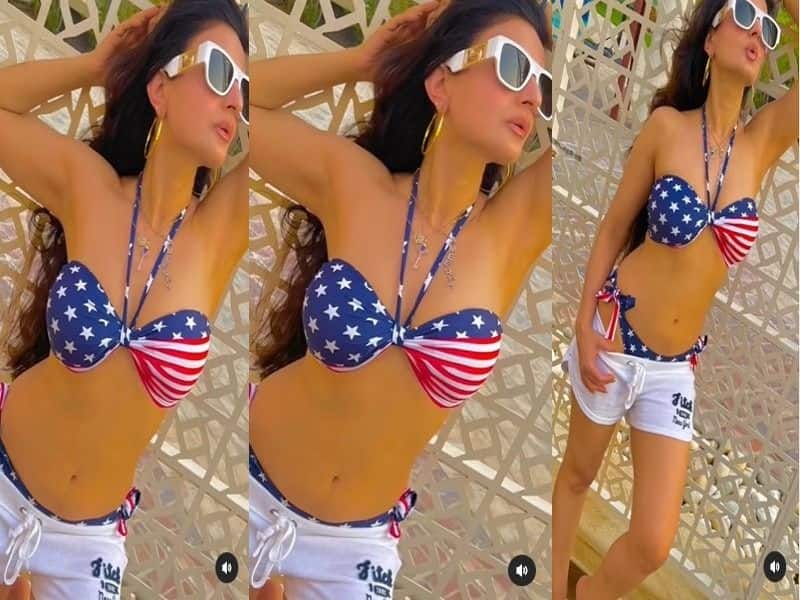  Amisha Patel goes Backless with her sexy and hot look in the sea beach of Bahrain  
