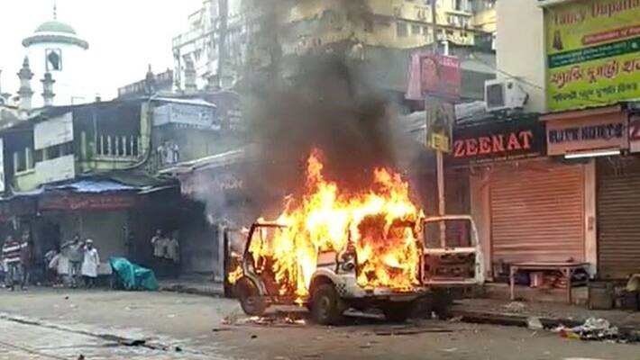 TMC published picture of Nishith Pramanik with person who set fire to police car in Nabanna abhijan bsm TMC published picture of Nishith Pramanik with person who set fire to police car in Nabanna abhijan bsm