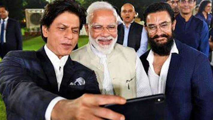 bollywood star shah rukh khan wishes pm modi, says take day off and enjoy bollywood star shah rukh khan wishes pm modi, says take day off and enjoy