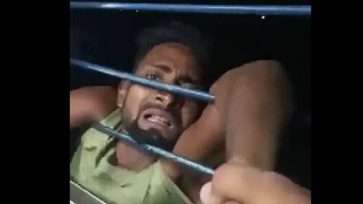 Bihar thief hangs from train window for more than 10 kilometres as passengers take hold of him Bihar thief hangs from train window for more than 10 kilometres as passengers take hold of him