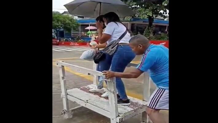 Viral Reddit post showed man transporting people across road with help of wooden cart apa Viral Reddit post showed man transporting people across road with help of wooden cart apa
