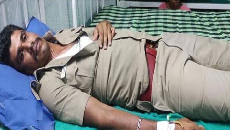 bjp party members attacked the police inspector at kovilpatti