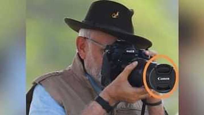 Fact Check: What is true in PM Modi posing with lens cap of camera shared by Congress Fact Check: What is true in PM Modi posing with lens cap of camera shared by Congress