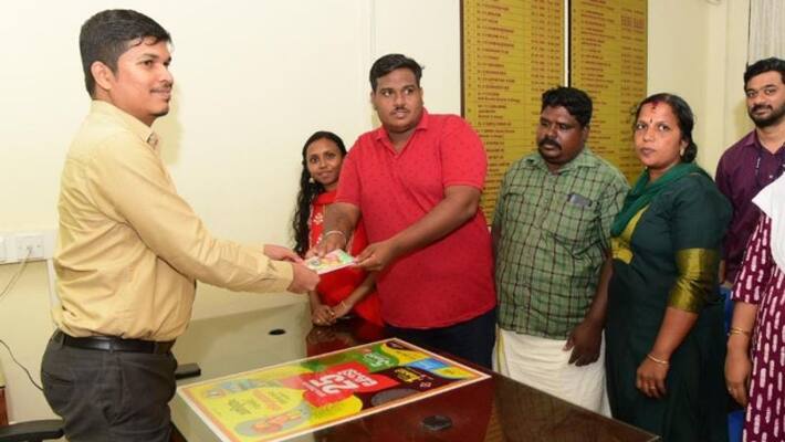 Thiruvonam bumper winner Anoop handed over 25 crore ticket to lottery department Thiruvonam bumper winner Anoop handed over 25 crore ticket to lottery department