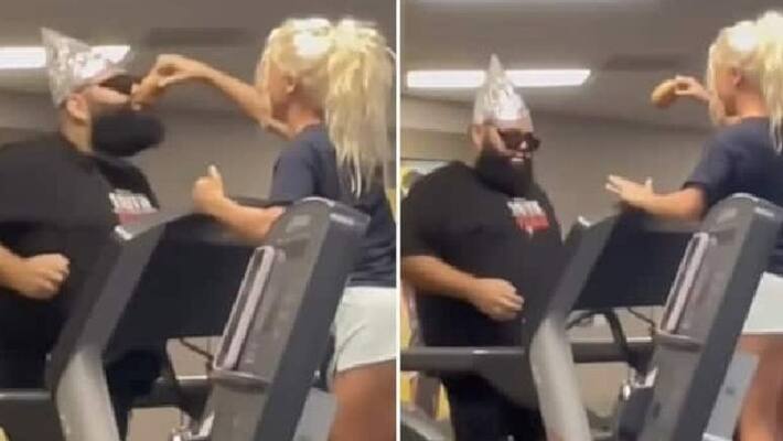 funny video in which woman motivates man to run faster in treadmill by showing him a snack funny video in which woman motivates man to run faster in treadmill by showing him a snack