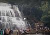 Tourists gathered at Suruli  waterfall in Theni district