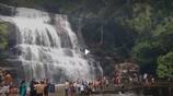 Tourists gathered at Suruli  waterfall in Theni district