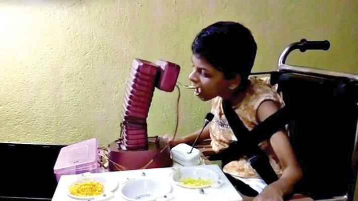 Goan father builds robot feeding special child Goan father builds robot feeding special child