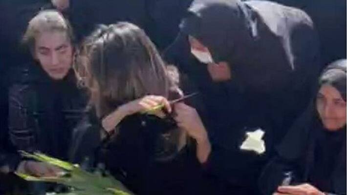viral video woman chops hair on grave of brother killed in anti hijab protest iran ash viral video woman chops hair on grave of brother killed in anti hijab protest iran ash